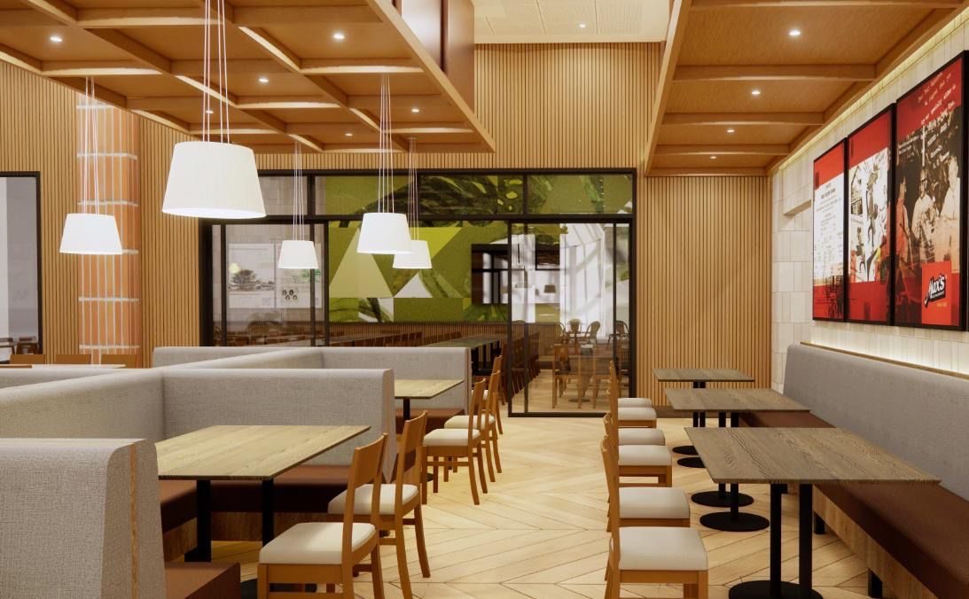 Cafe interior with upholstered booth seating, timber tables and chairs and pendant lights