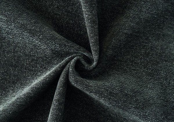 Close view of a tightly woven, hard-wearing upholstery fabric in a deep green melange from the Vespera collection