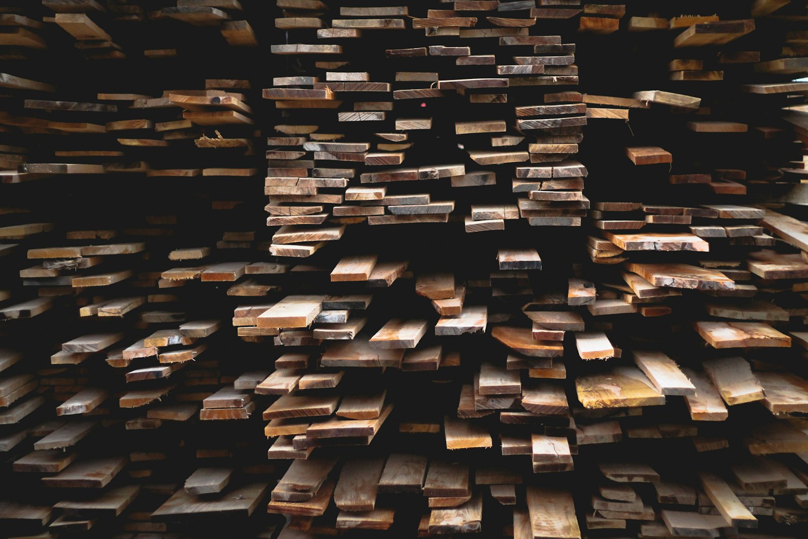 Stacked hardwood boards seasoning before kiln-drying